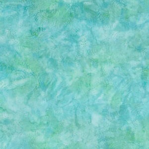 blue/green/white tie dye colors with speckled dots in a batik pattern