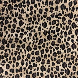 black and brown cheetah spots on a light tan background