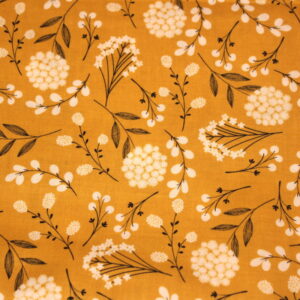 white dandelions with stems on a mustard yellow background