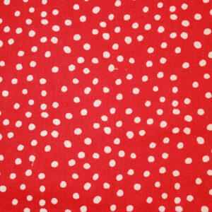 white polka dots on a red background