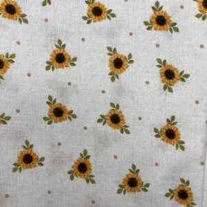 yellow sunflowers on a white cream background with brown dots